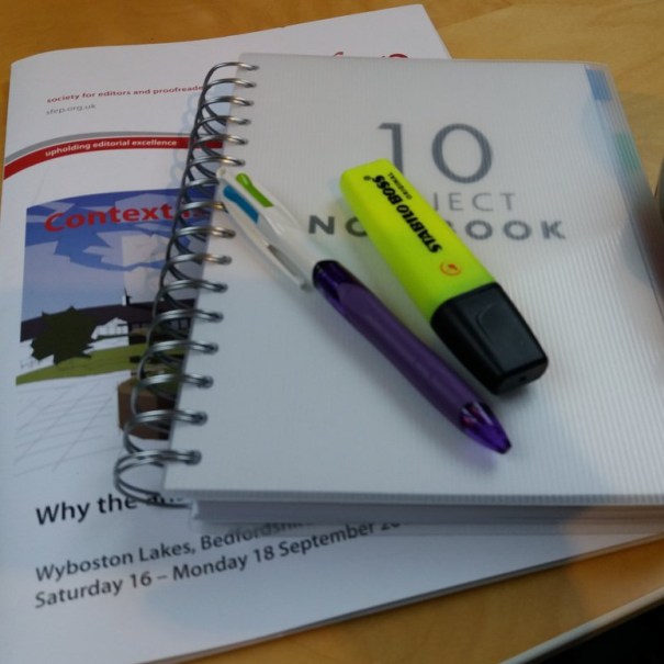 Notepad, pens and conference programme